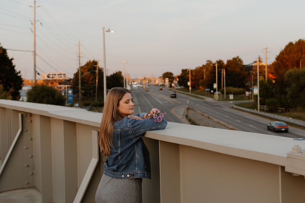 Bells Corners Bridge. A paved multi-use pathway winding through lush green trees in the Ottawa Greenbelt.