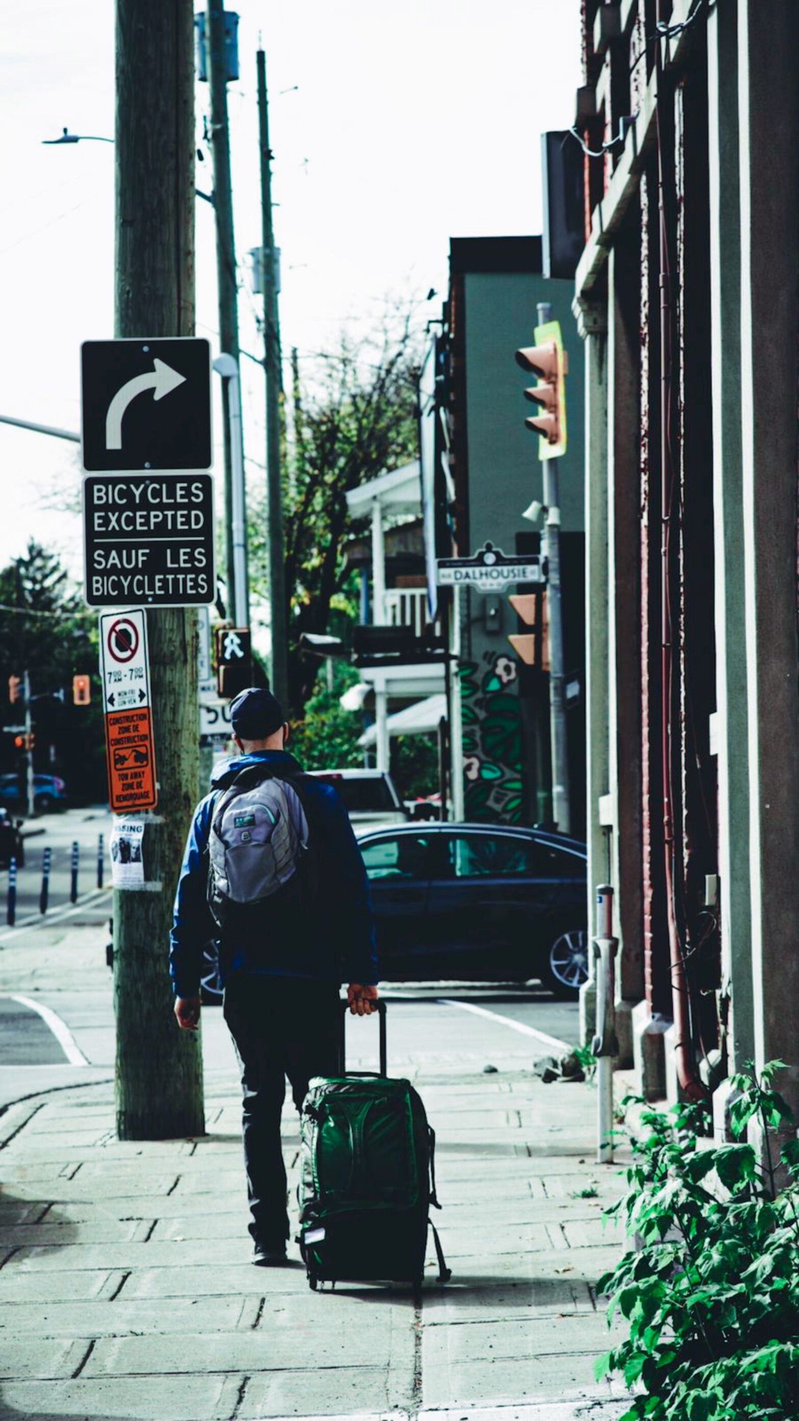 A man walks through the city. Image introduces an article on the cost of living in Ottawa.