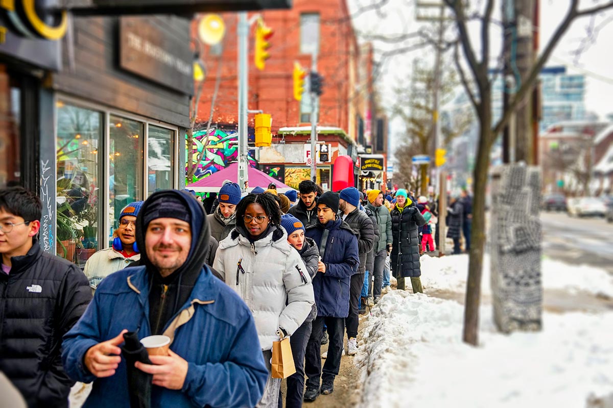Volunteers collaborating and smiling together during a local Ottawa community initiative.